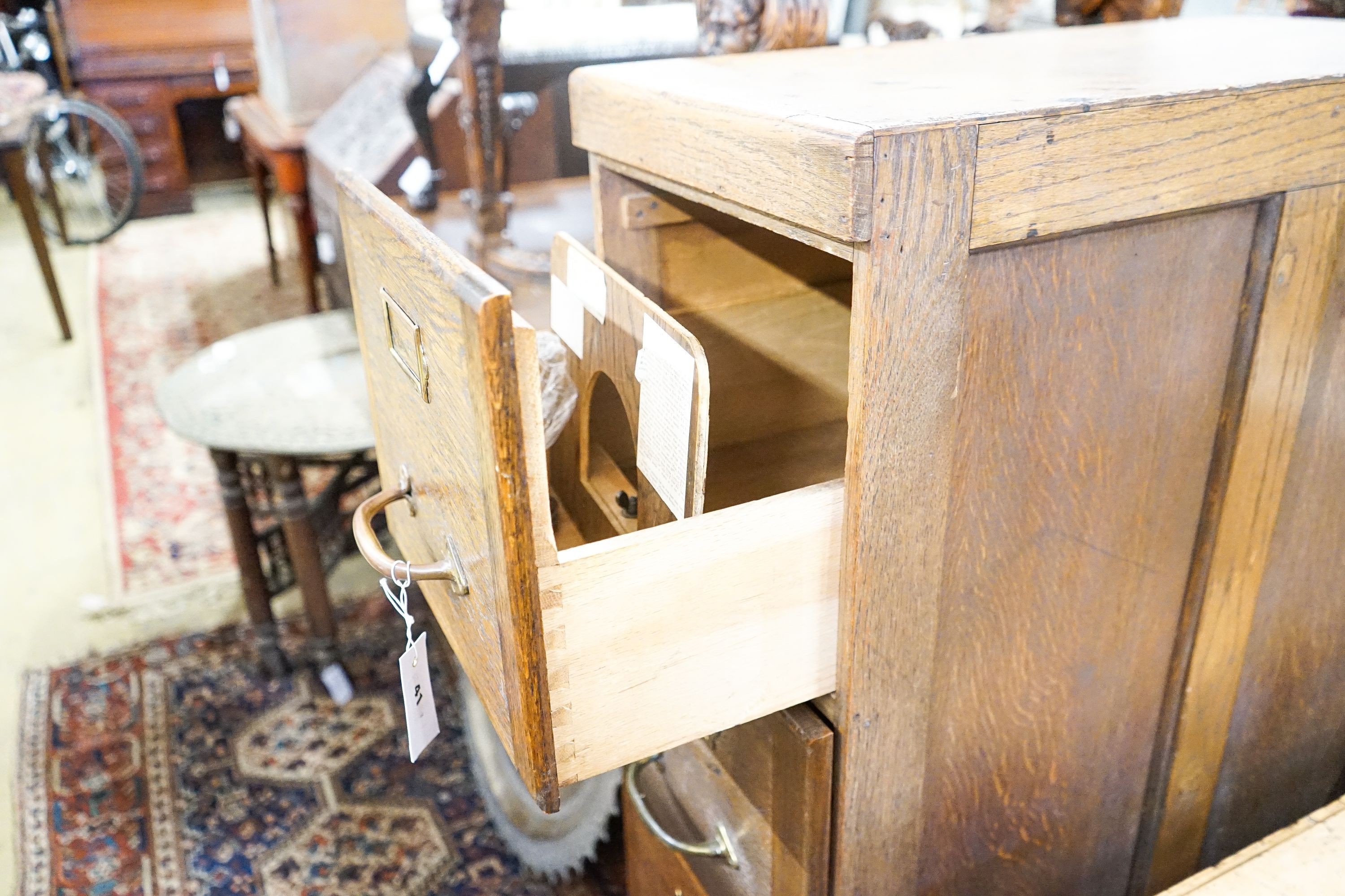 An early 20th century oak four drawer filing cabinet, width 37cm, depth 70cm, height 130cm